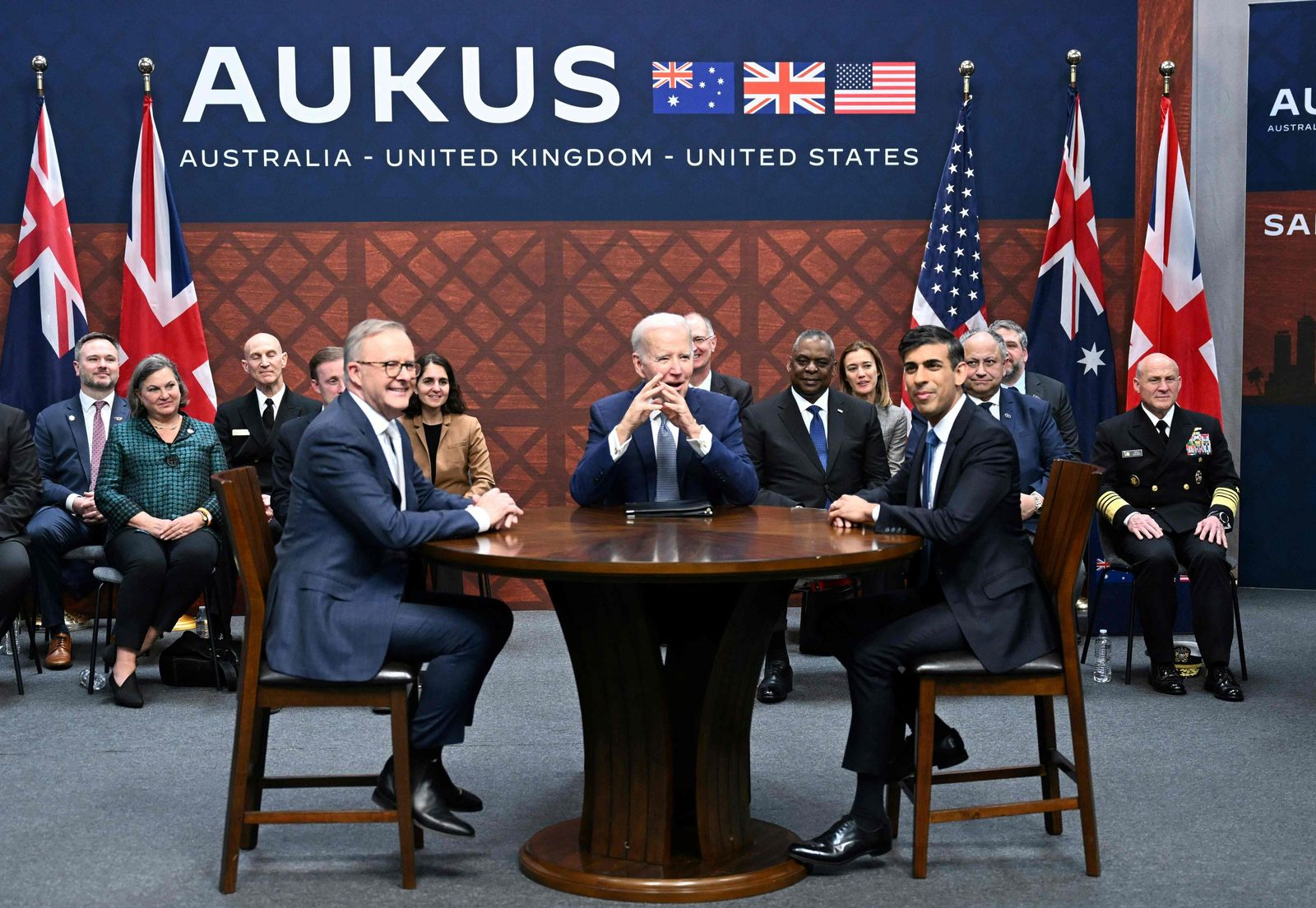 US President Joe Biden (C) participates in a trilateral meeting with British Prime Minister Rishi Sunak (R) and Australia's Prime Minister Anthony Albanese (L) during the AUKUS summit on March 13, 2023, at Naval Base Point Loma in San Diego California. - AUKUS is a trilateral security pact announced on September 15, 2021, for the Indo-Pacific region. (Photo by Jim WATSON / AFP) - AFP
