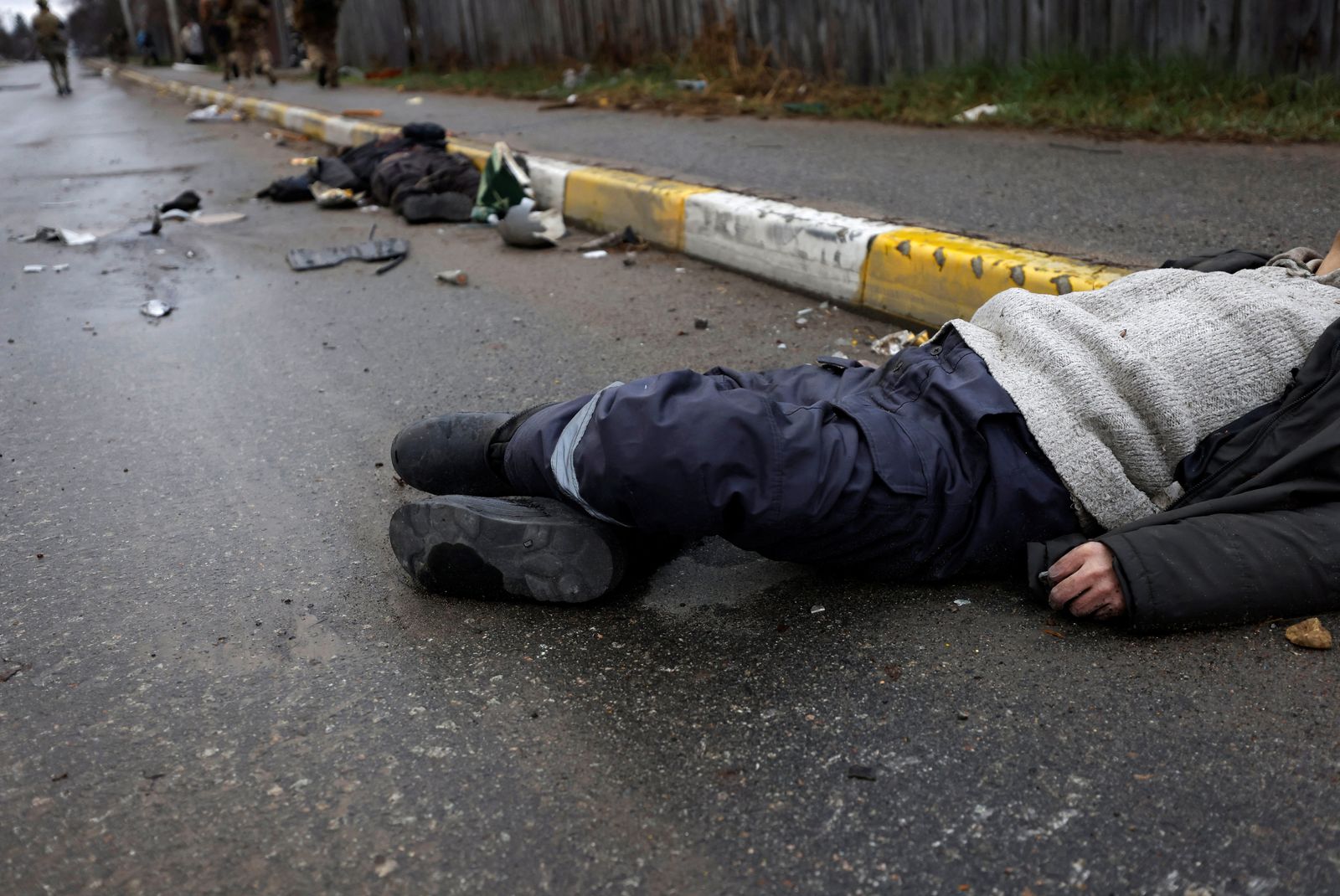 Bodies of civilians, who according to residents was killed by Russian army soldiers, lie on the street, amid Russia's invasion of Ukraine, in Bucha - REUTERS