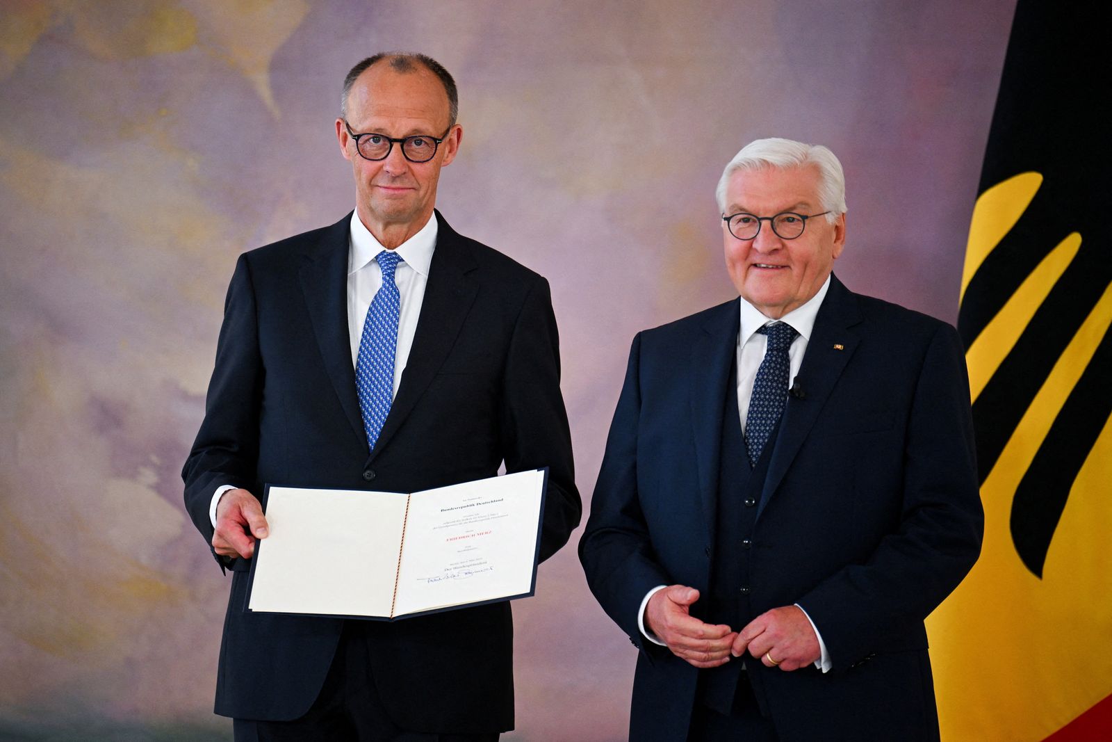 Incoming German Chancellor Friedrich Merz receives his certificate of appointment from German President Frank-Walter Steinmeier during a ceremony at Bellevue Palace in Berlin, Germany May 6, 2025. REUTERS/Annegret Hilse     TPX IMAGES OF THE DAY