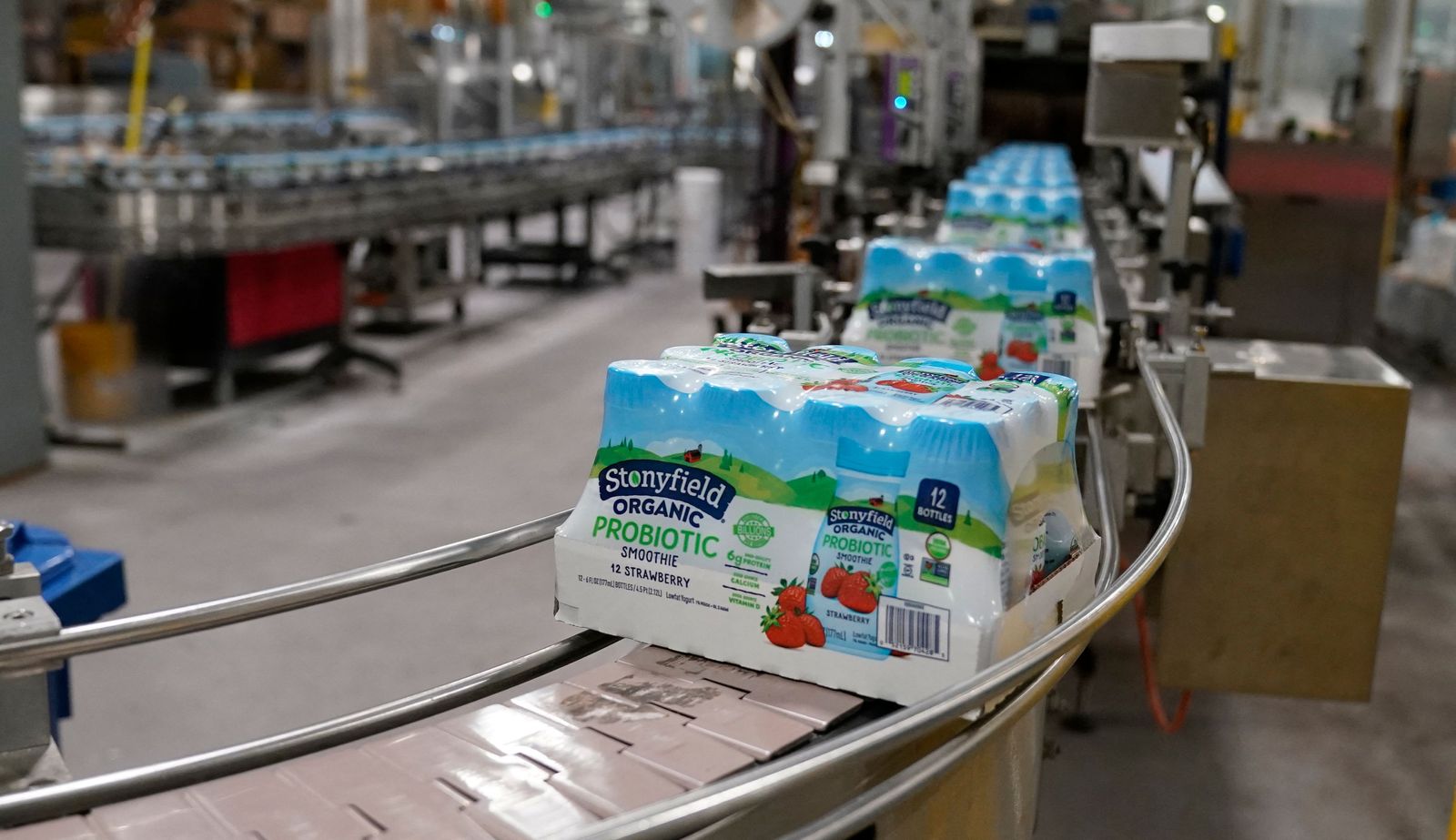 Yogurt products on the assembly line at the Stonyfield Farm plant in Londonderry, New Hampshire on May 4, 2022. - The new production line at Stonyfield's Londonderry plant churns out 800,000 plastic yogurts a week, and the company, a subsidiary of French dairy giant Lactalis, plans to build a second line this year. Stonyfield's organic baby and children's products, based in Londonderry in the northeastern U.S., are the fastest-growing category in the U.S. for Lactalis, and the company wants to take advantage of that. (Photo by TIMOTHY A. CLARY / AFP) - AFP
