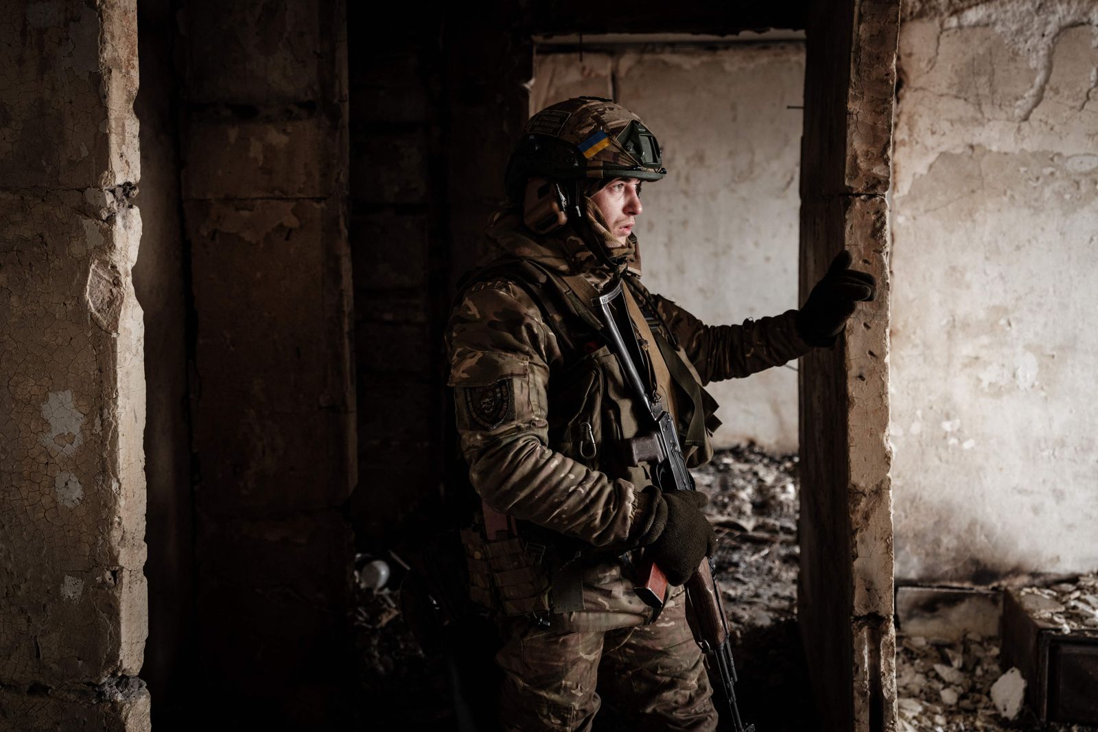 A Ukrainian serviceman of the State Border Guard Service works in a position in Bakhmut on February 9, 2023, amid the Russian invasion of Ukraine. (Photo by YASUYOSHI CHIBA / AFP) - AFP