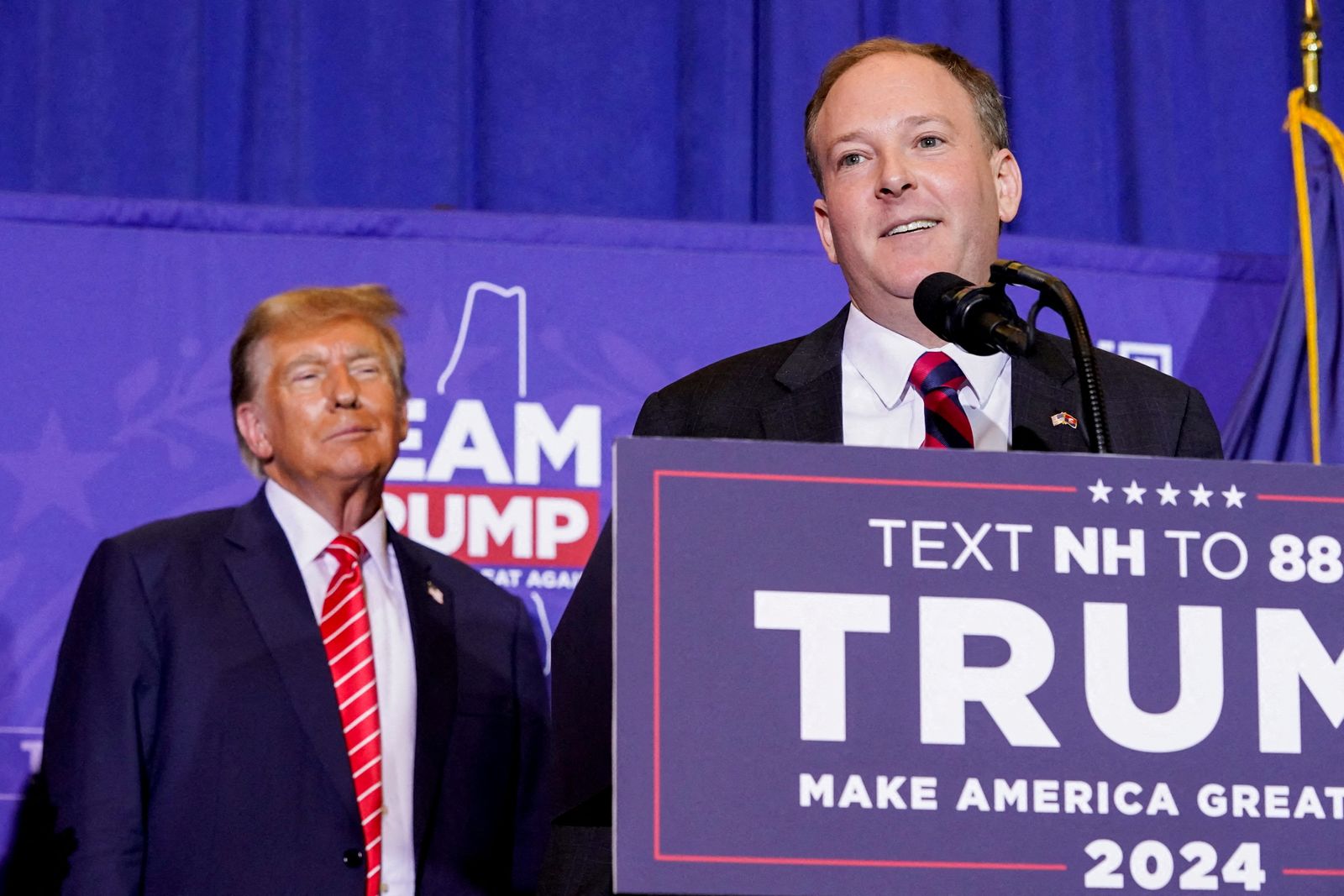 FILE PHOTO: U.S. President and Republican presidential candidate Donald Trump reacts as former U.S. Representative Lee Zeldin speaks at a rally ahead of the New Hampshire primary election in Concord, New Hampshire, U.S. January 19, 2024. REUTERS/Elizabeth Frantz/File Photo