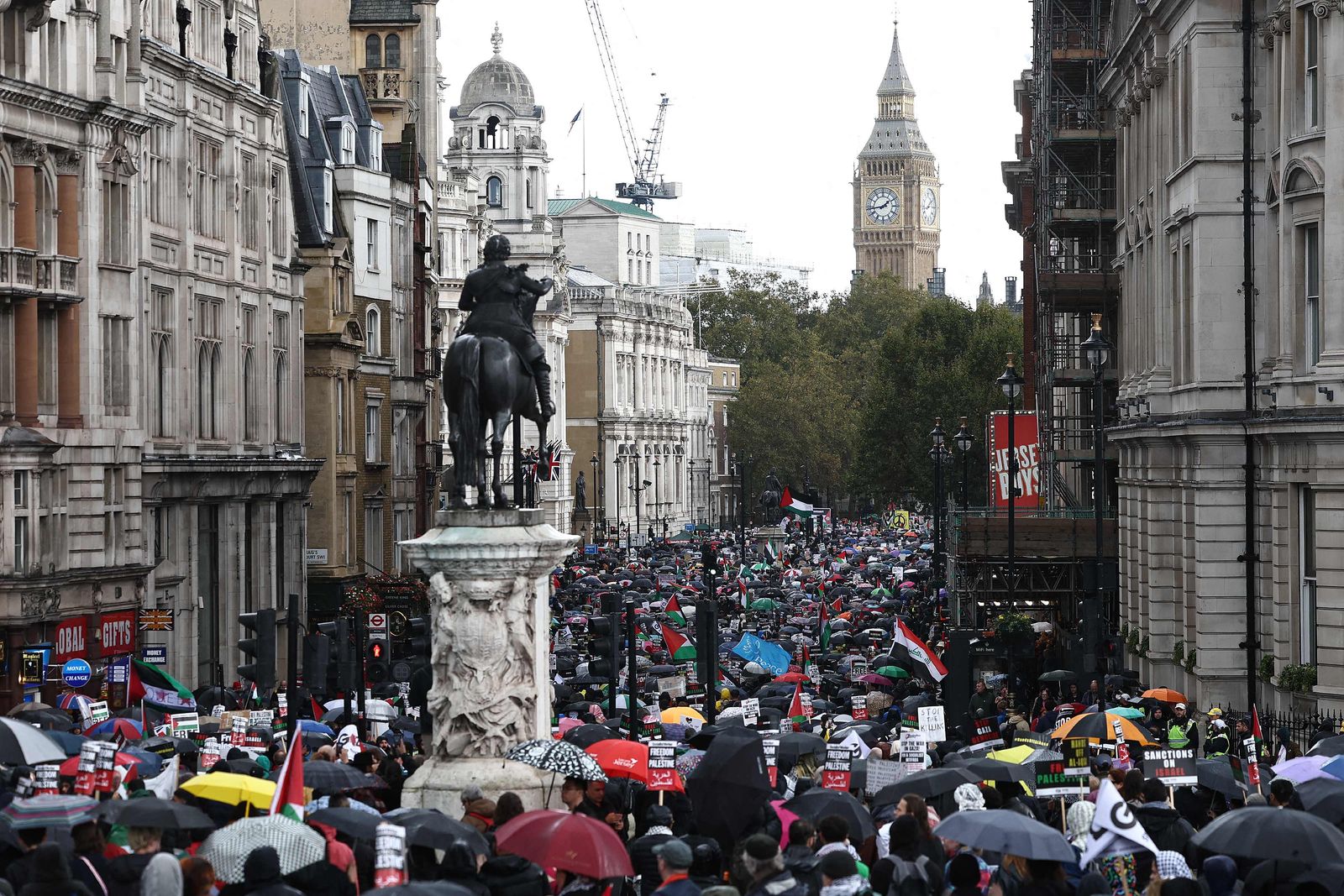 People take part in a 'March For Palestine', in London on October 21, 2023, to 'demand an end to the war on Gaza'. The UK has pledged its support for Israel following the bloody attacks by Hamas, which killed more than 1,400 people, and has announced that humanitarian aid to the Palestinians will be increased by a third -- an extra �10 million pounds ($12 million). Israel is relentlessly bombing the small, crowded territory of Gaza, where more than 3,400 people have been killed, most of them Palestinian civilians, according to the local authorities. (Photo by HENRY NICHOLLS / AFP)