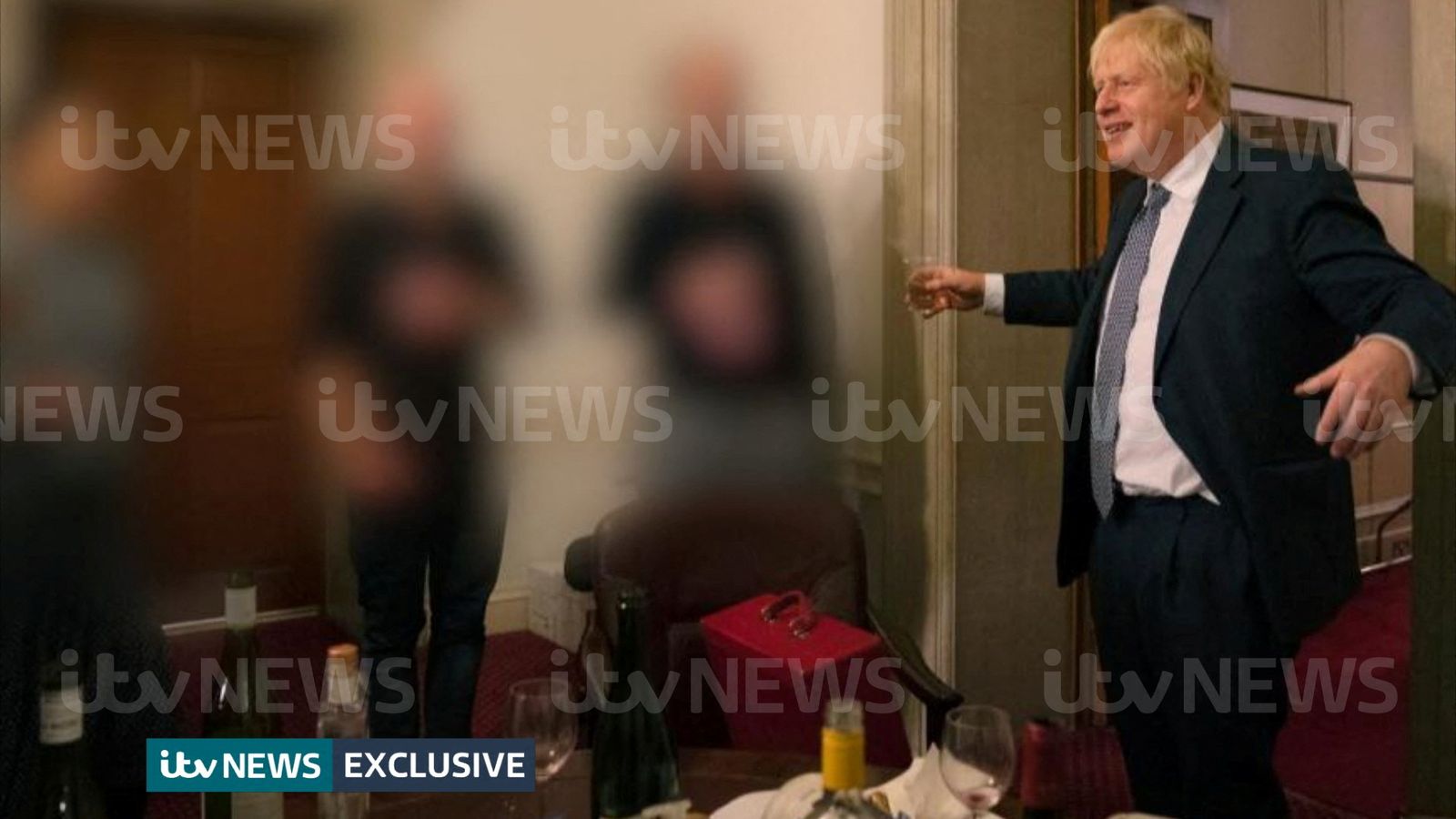 A handout picture shows British Prime Minister Boris Johnson raising a glass during a party at Downing Street, amid the coronavirus disease (COVID-19) pandemic in London - VIA REUTERS