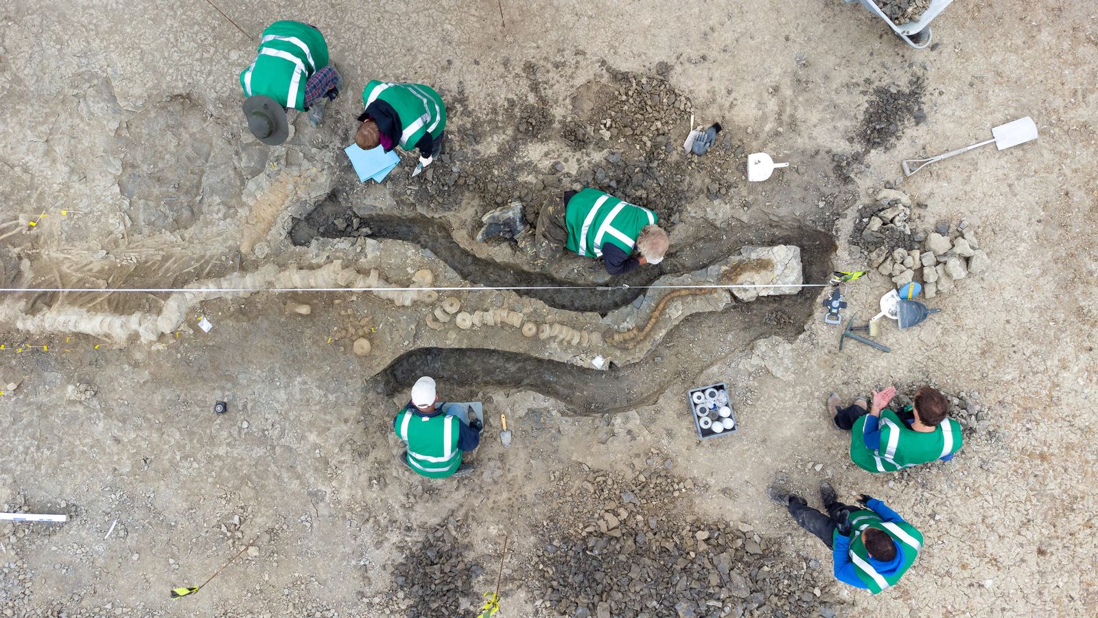 Palaeontologists work at a site where remains of a Britain's largest ichthyosaur were found, at Rutland Water - ANGLIAN WATER via REUTERS