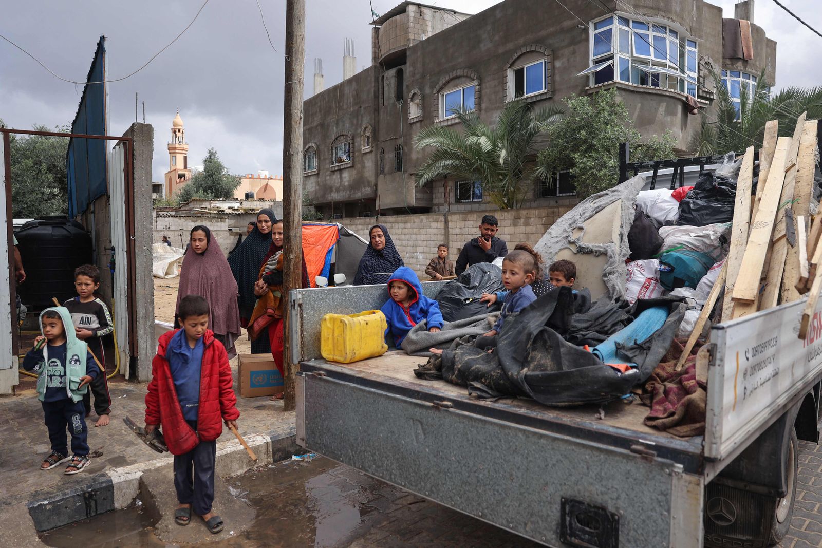 Displaced Palestinians in Rafah in the southern Gaza Strip pack their belongings following an evacuation order by the Israeli army on May 6, 2024, amid the ongoing conflict between Israel and the Palestinian Hamas movement. (Photo by AFP)