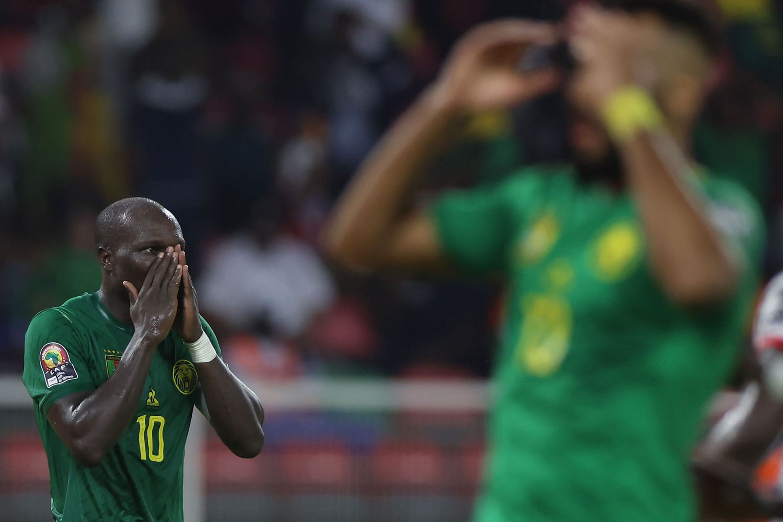 Cameroon's forward Vincent Aboubakar (L) reacts after shooting and failing to score during the Group A Africa Cup of Nations (CAN) 2021 football match between Cameroon and Burkina Faso at Stade d'Olemb� in Yaounde on January 9, 2022. (Photo by Kenzo Tribouillard / AFP) - AFP