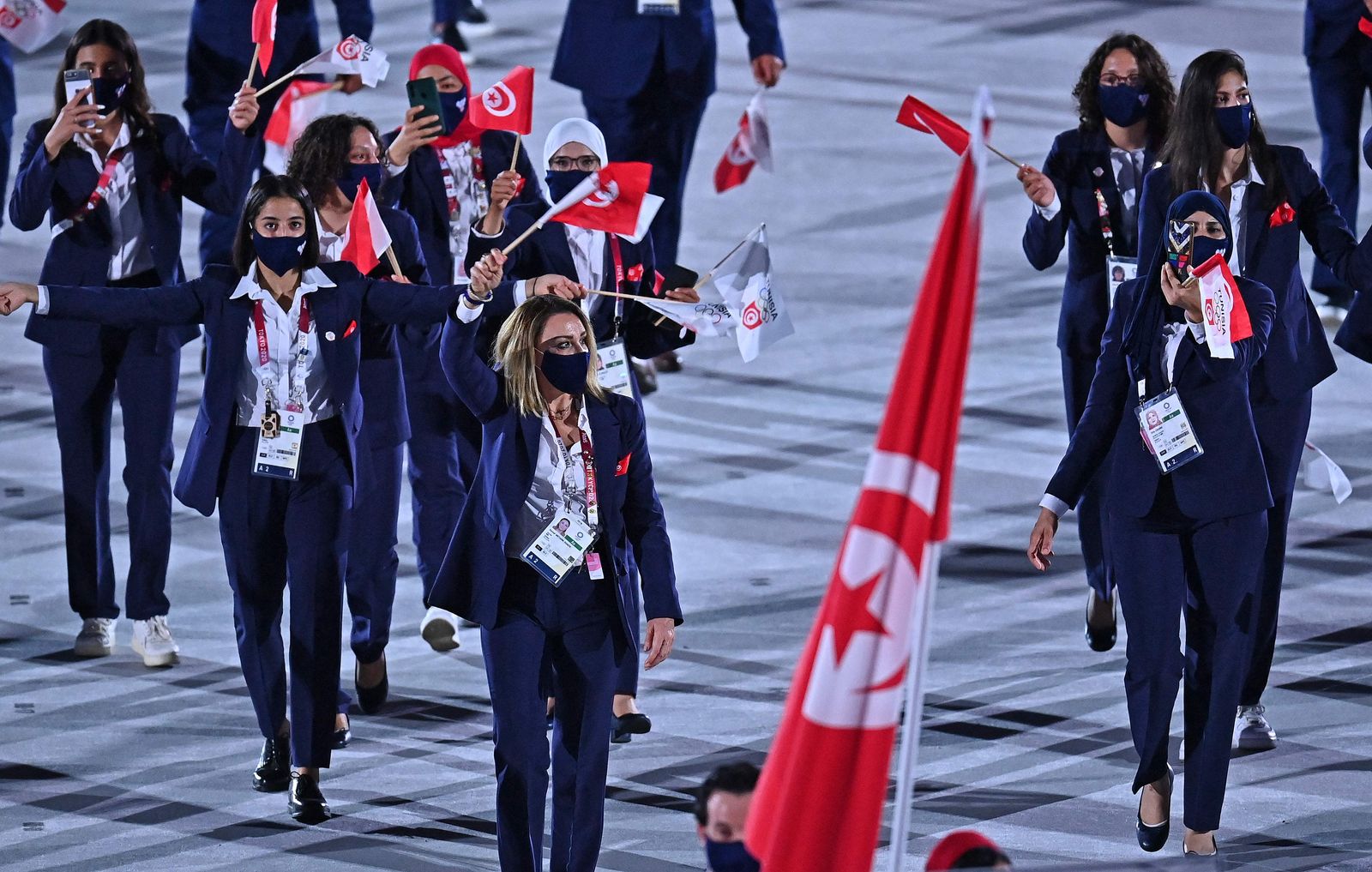 Tunisia's delegation parade during the opening ceremony of the Tokyo 2020 Olympic Games, at the Olympic Stadium, in Tokyo, on July 23, 2021. (Photo by Ben STANSALL / AFP) - AFP