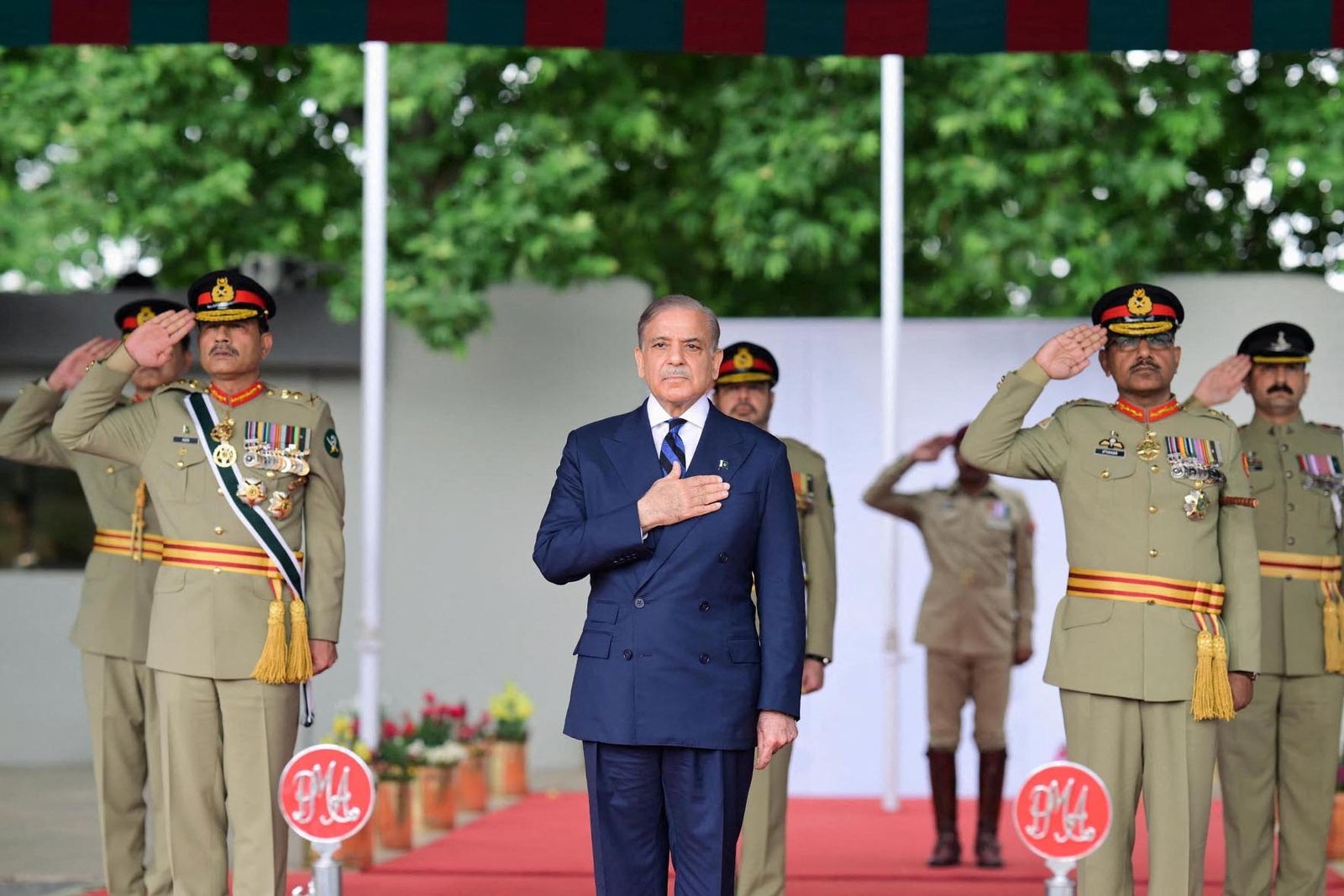 Pakistan's Prime Minister Shehbaz Sharif, along with Chief of the Army Staff (COAS) of Pakistan Asim Munir, reviews the parade at the passing out ceremony of 151st Long Course at the Pakistan Military Academy (PMA) Kakul, Abbottabad, Pakistan April 26, 2025. Press Information Department (PID)/Handout via REUTERS ATTENTION EDITORS - THIS PICTURE WAS PROVIDED BY A THIRD PARTY.