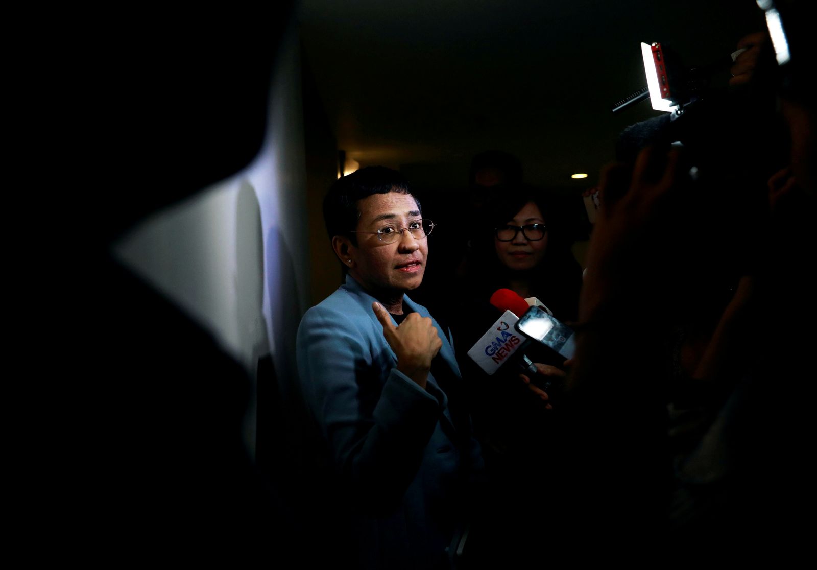 FILE PHOTO: Maria Ressa, an executive of online news platform Rappler, speaks to the media after being served an arrest warrant in Rappler's office in Pasig City - REUTERS