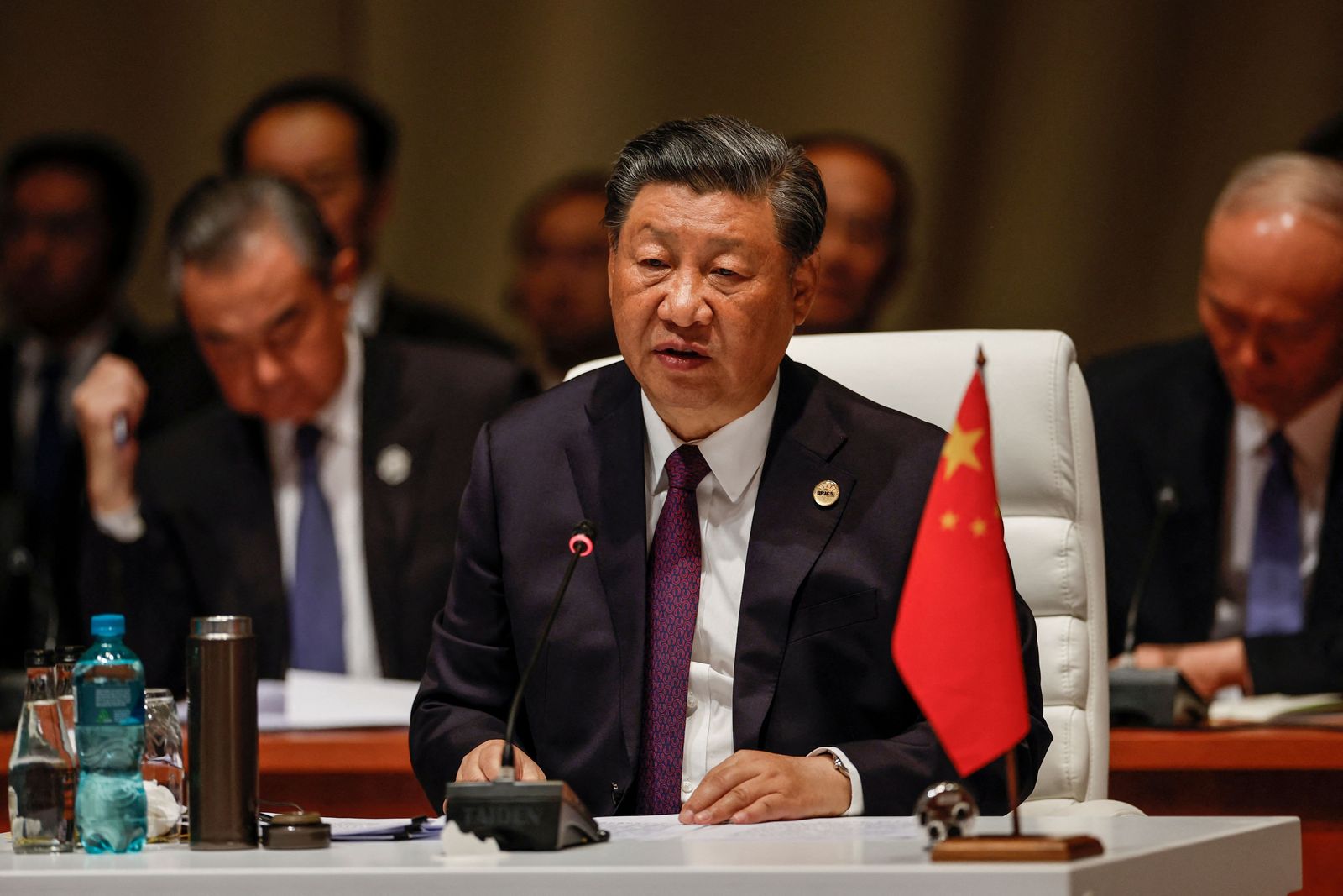 President of China Xi Jinping attends the plenary session during the 2023 BRICS Summit at the Sandton Convention Centre in Johannesburg on August 23, 2023. (Photo by GIANLUIGI GUERCIA / POOL / AFP) - AFP