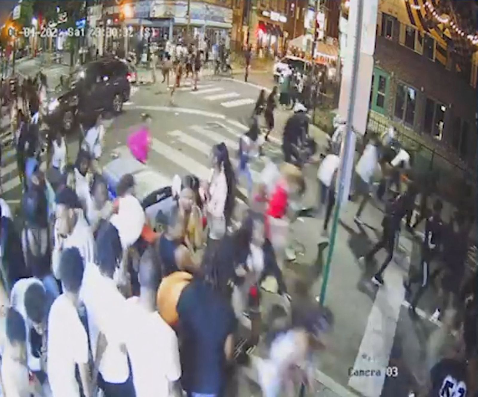 A screen grab from a surveillance video from the shooting shows people on a crowded street running in panic, presumably after gun shots were fired, in Philadelphia, Pennsylvania - via REUTERS