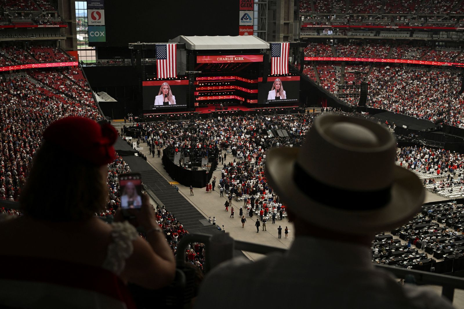 Erika Kirk, slain conservative commentator Charlie Kirk's widow, speaks as people attend a memorial service for him at State Farm Stadium, in Glendale, Arizona, U.S., September 21, 2025. REUTERS/Callaghan O'Hare