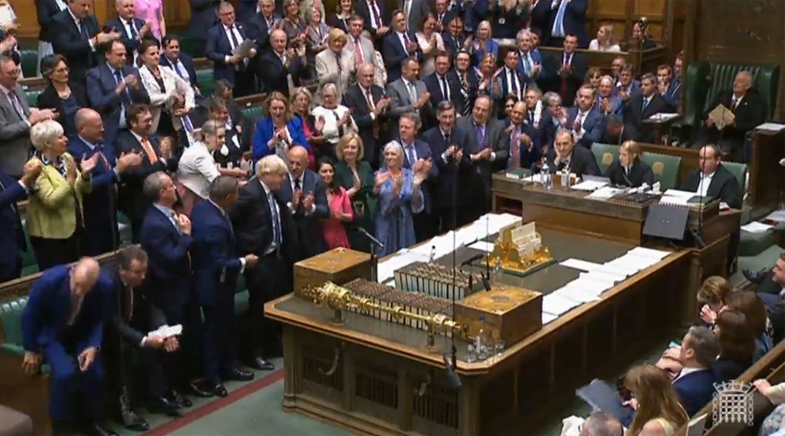 A video grab from footage broadcast by the UK Parliament's Parliamentary Recording Unit (PRU) shows members of Parliament applauding Britain's Prime Minister Boris Johnson as he leaves at the end of his last weekly Prime Minister's Questions (PMQs) session at the House of Commons, in London, on July 20, 2022. - The final two candidates to become UK prime minister will be decided on July 20, 2022, with Foreign Secretary Liz Truss and Penny Mordaunt battling it out to make an expected runoff against frontrunner Rishi Sunak. (Photo by PRU / AFP) / RESTRICTED TO EDITORIAL USE - MANDATORY CREDIT 