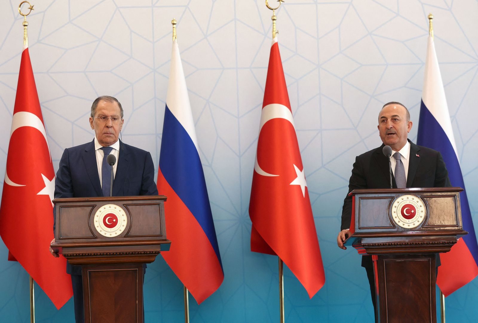 Russian Foreign Minister Sergei Lavrov (L) speaks with Turkish Foreign Minister Mevlut Cavusoglu (R) as they meet in Ankara, on June 8, 2022. - Turkey's foreign minister called Russian demands for an end to sanctions to help grain onto the world market 