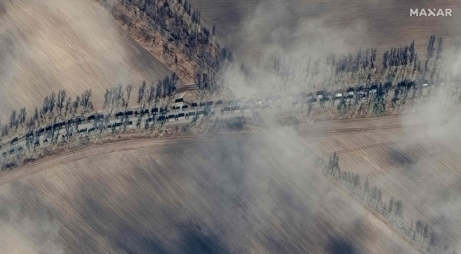 This Maxar satellite image taken and released on February 27, 2022, shows the Southern end of a deployment of Russian ground forces, moving troops and equipment, in Ivankiv, Ukraine. - Tens of thousands of Ukrainians have fled their country since Russian President Vladimir Putin unleashed a full-scale invasion on Thursday. (Photo by Satellite image �2022 Maxar Technologies / AFP) / RESTRICTED TO EDITORIAL USE - MANDATORY CREDIT 