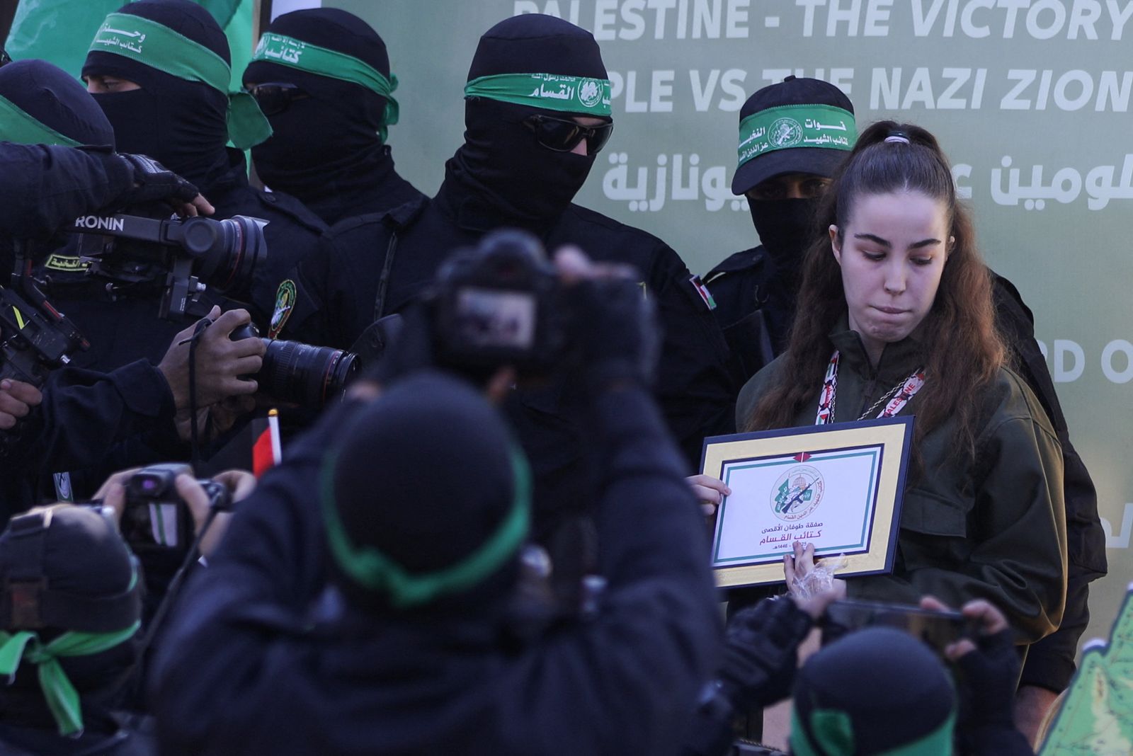 Palestinian Hamas militants release female Israeli soldier Agam Berger held in Gaza since the deadly October 7 2023 attack, as part of a ceasefire and a hostages-prisoners swap deal between Hamas and Israel, in Jabalia, in the northern Gaza Strip, January 30, 2025. REUTERS/Dawoud Abu Alkas