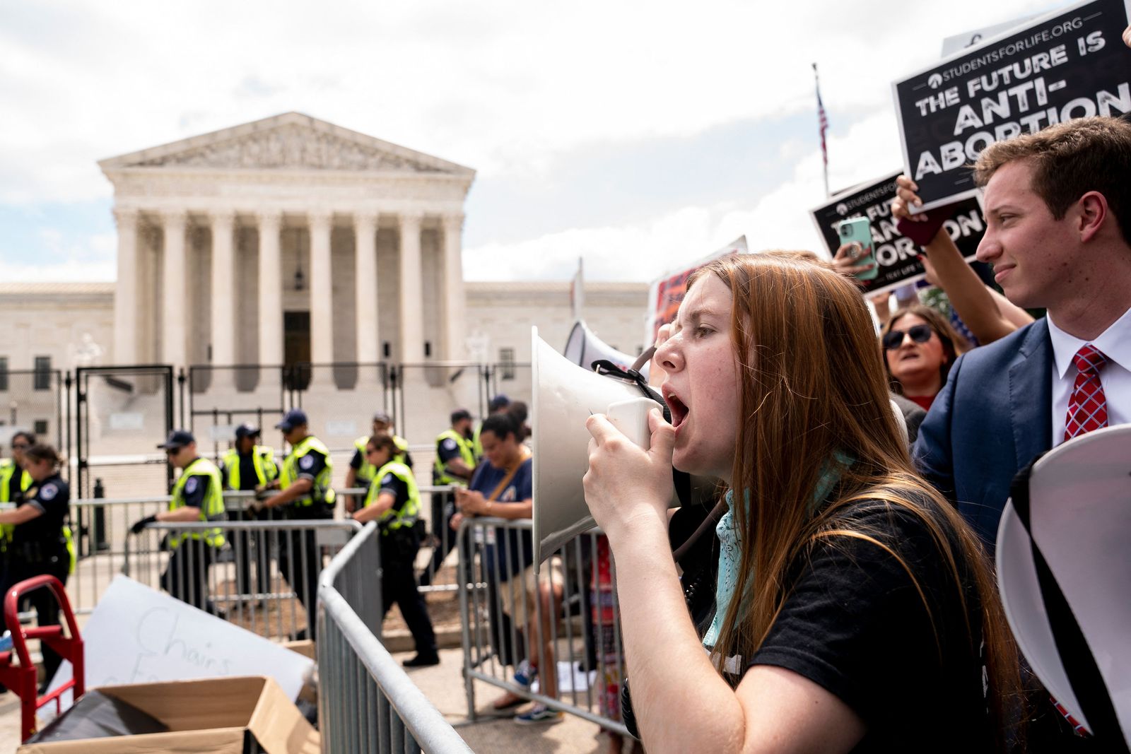 Anit-abortion activists gather outside the US Supreme Court in Washington, DC, on June 24, 2022. - The US Supreme Court on Friday ended the right to abortion in a seismic ruling that shreds half a century of constitutional protections on one of the most divisive and bitterly fought issues in American political life. The conservative-dominated court overturned the landmark 1973 