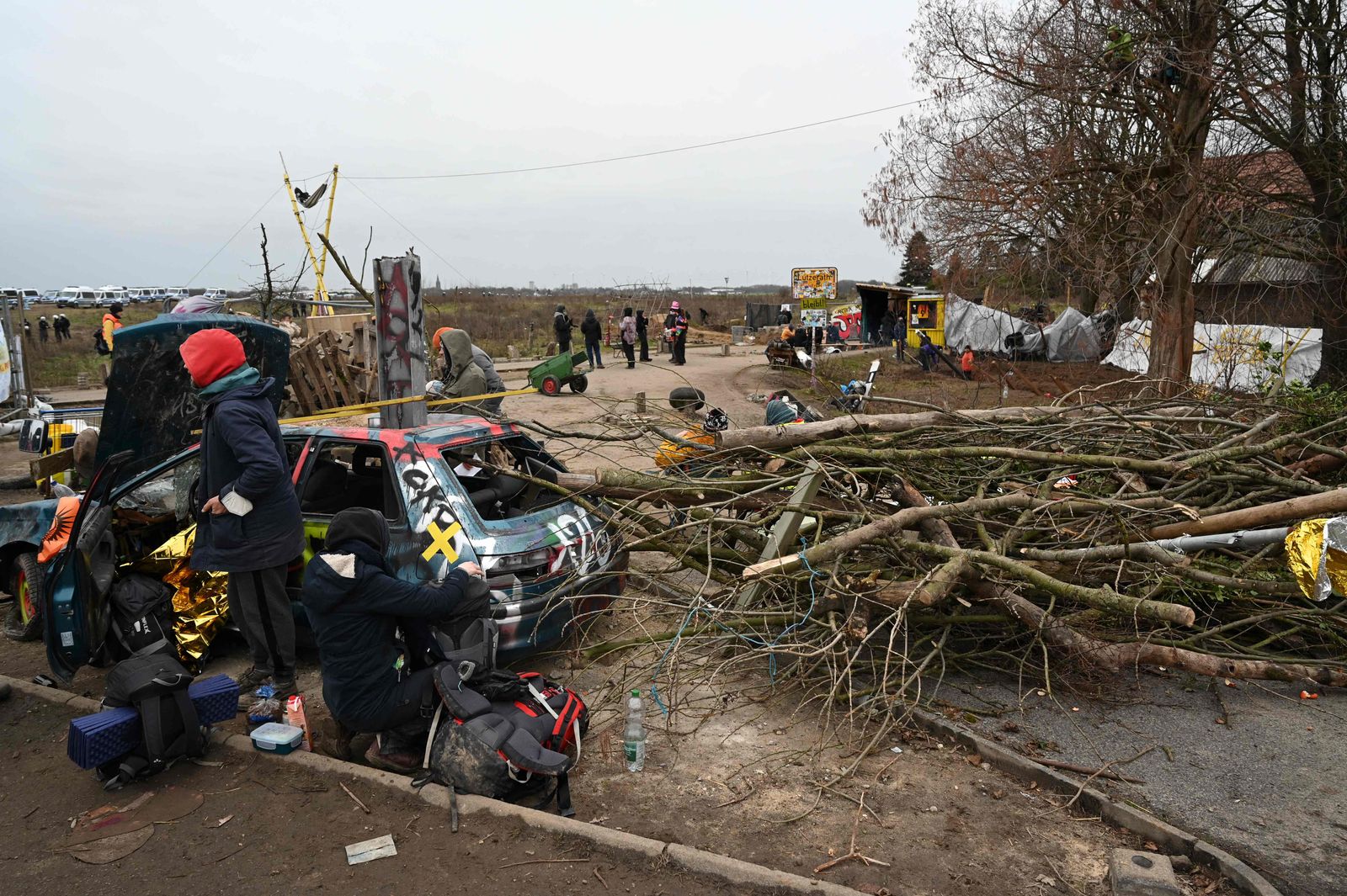 Tree trunks and an old car have been set up as a barricade while anti-coal activists stage an 