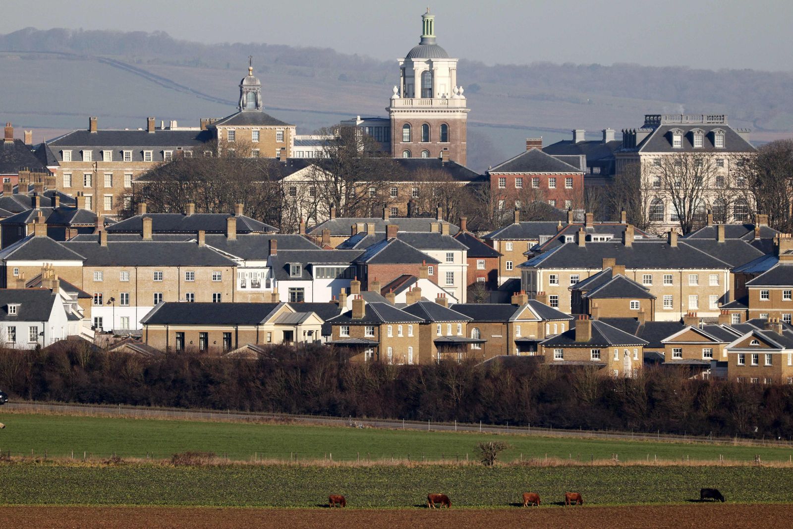 A photograph taken on February 7, 2023 shows a general view of Poundbury and the surrounding fields. - Poundbury is an experimental planned community or urban extension on the western outskirts of Dorchester in the county of Dorset, southern England made by Britain's King Charles III. Poundbury was developed on land belonging to the Duchy of Cornwall, a royal estate run under the stewardship of the Prince of Wales. (Photo by Adrian DENNIS / AFP) - AFP