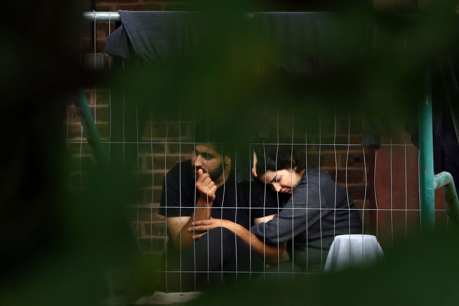 Detainees inside immigration processing centre in Manston - REUTERS