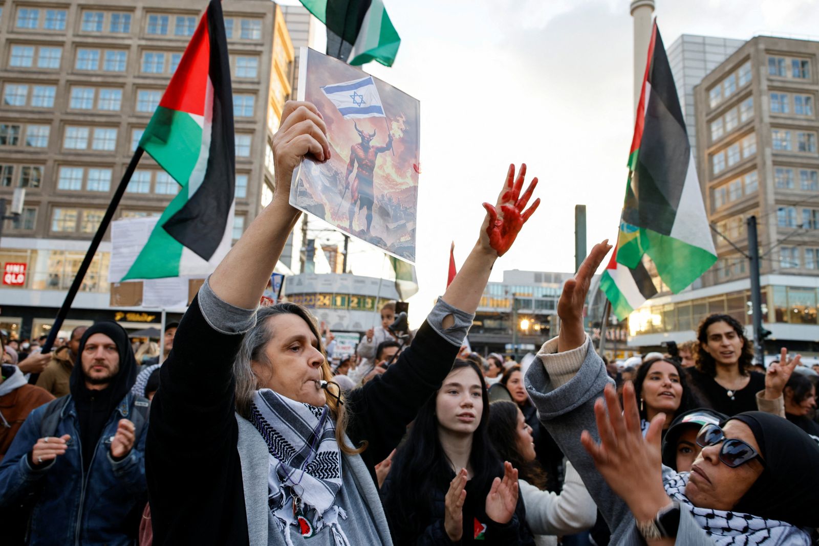 A person shows a hand stained with fake blood, during a protest in support of Palestinians in Gaza and to condemn the Israeli forces' interception of some of the vessels of the Global Sumud Flotilla aiming to reach Gaza and break Israel's naval blockade, in Berlin, Germany, October 2, 2025. REUTERS/Axel Schmidt