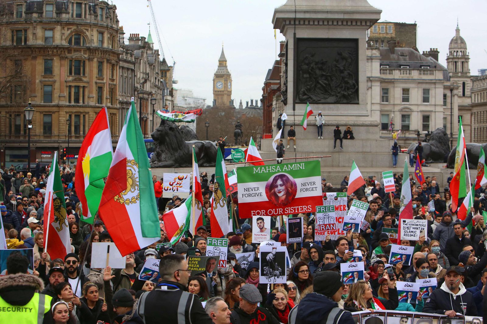 Protesters hold up placards after a march marking 44th anniversary of Iranian revolution, in Trafalgar Square, central London on February 11, 2023, as protests against the Iranian regime continue. (Photo by Susannah Ireland / AFP) - AFP