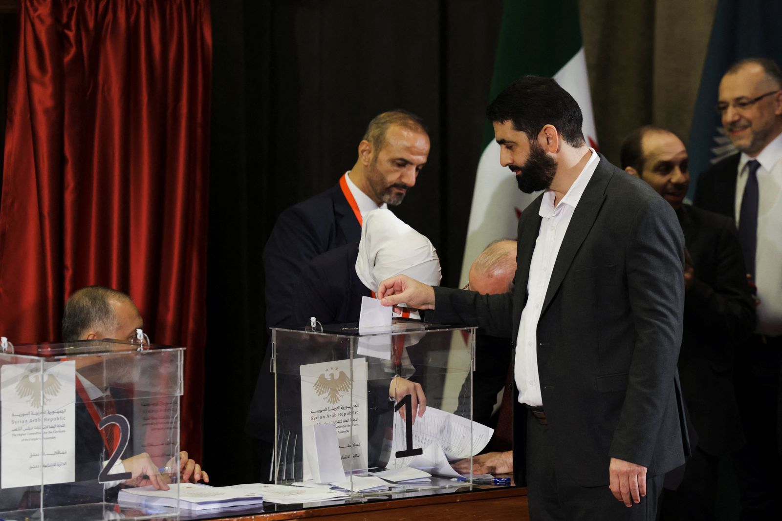 A member of the electoral colleges votes to select his candidate for the new Syrian Parliament since Bashar al-Assad's government was toppled, in Damascus, Syria, October 5, 2025. REUTERS/Khalil Ashawi
