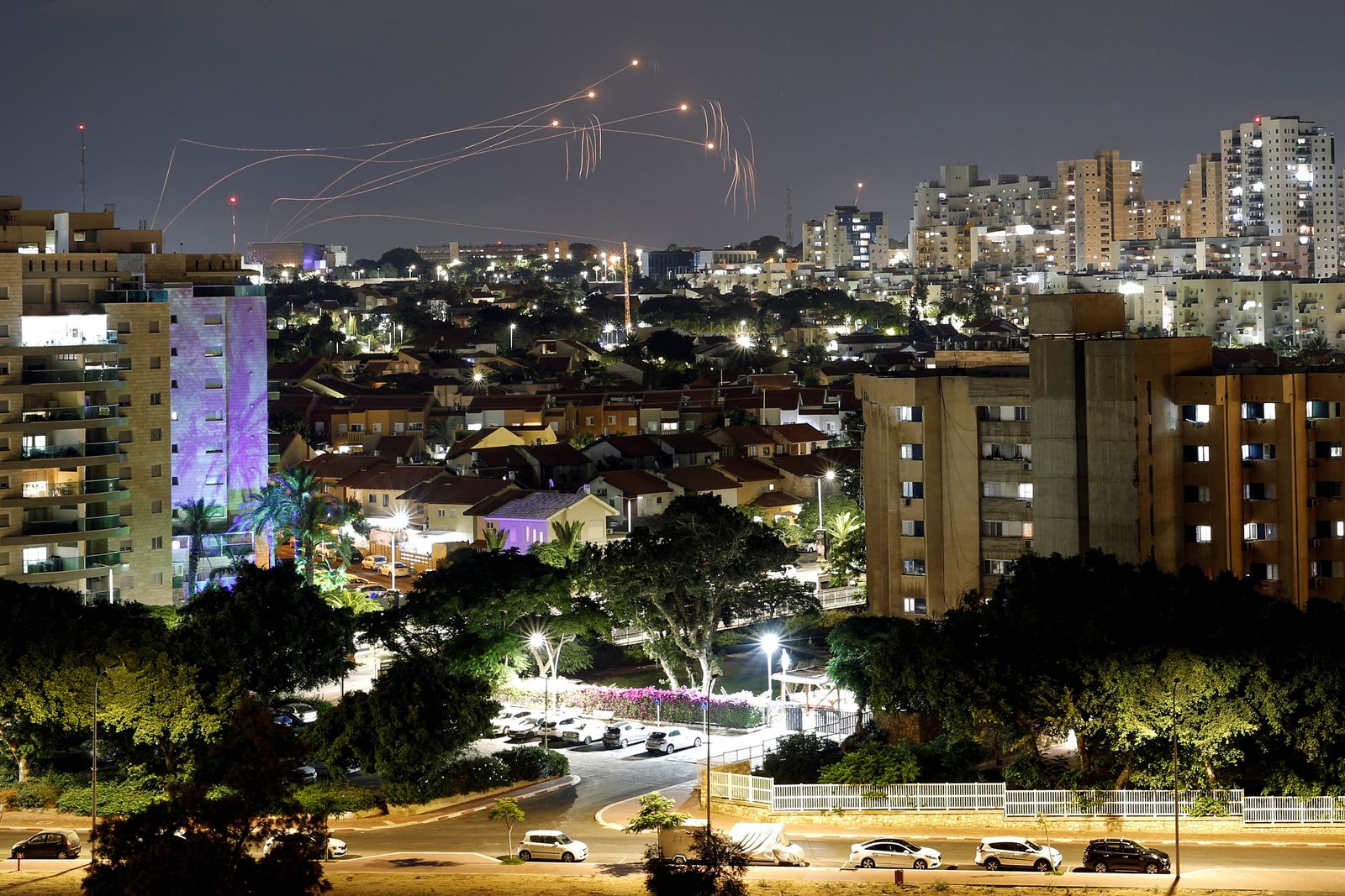 Streaks of light are seen as Israel's Iron Dome anti-missile system intercept rockets launched from the Gaza Strip towards Israel, as seen from Ashkelon - REUTERS