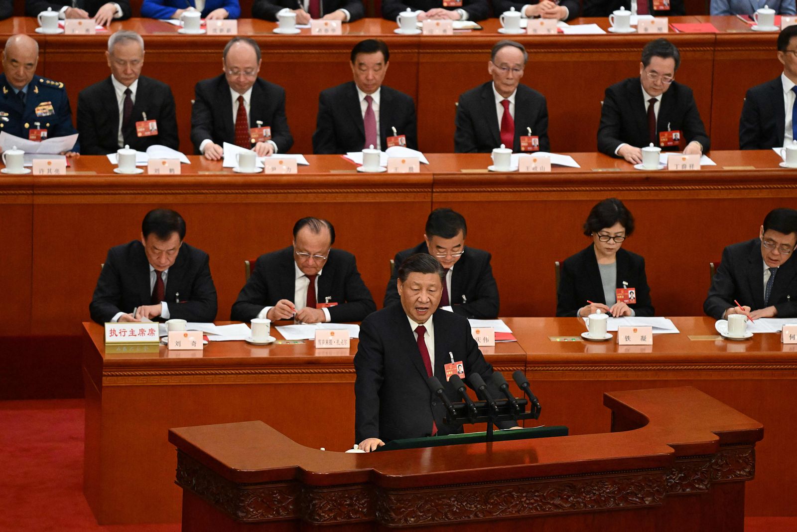 China's President Xi Jinping speaks during the closing session of the National People's Congress (NPC) at the Great Hall of the People in Beijing on March 13, 2023. (Photo by NOEL CELIS / POOL / AFP) - AFP