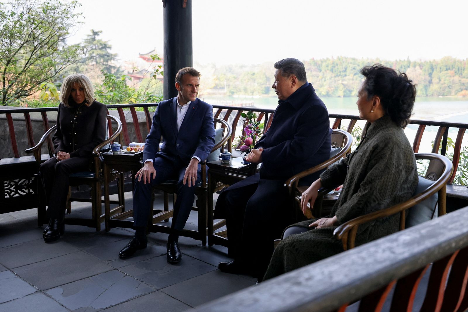French President Emmanuel Macron, his wife Brigitte Macron, Chinese President Xi Jinping and his wife Peng Liyuan visit the Dujiangyan site, designated a UNESCO World Heritage Site, in Dujiangyan, Sichuan province, as part of a three-day visit to China, December 5, 2025. REUTERS/Sarah Meyssonnier/Pool