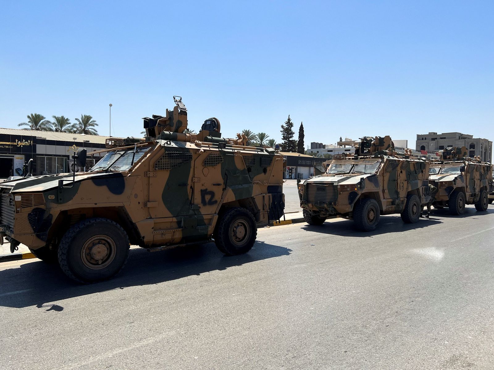 Military vehicles of the Libyan armed unit prepare to enter the area of clashed in Tripoli - REUTERS