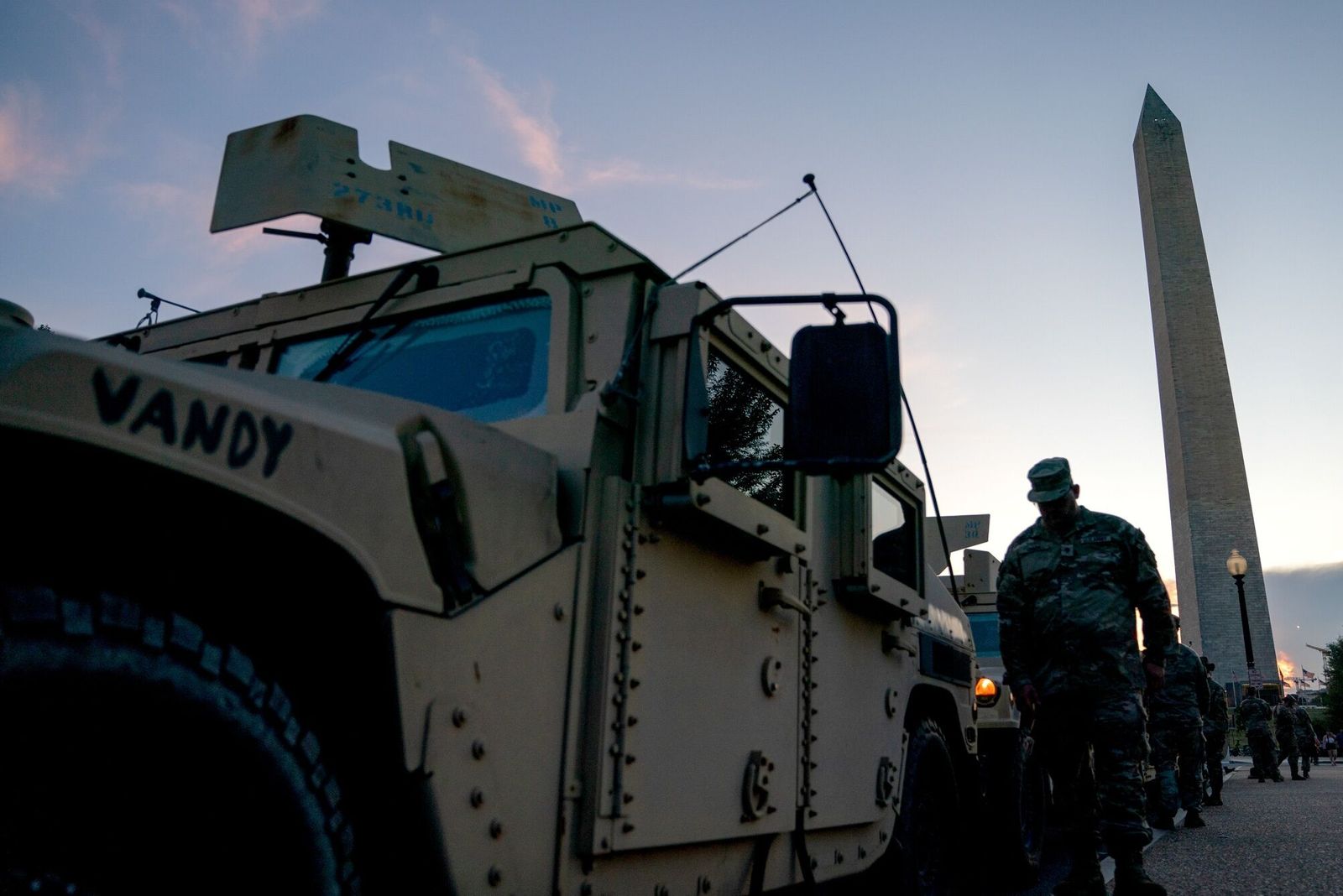 A member of the National Guard and armored vehicles near the Washington Monument in Washington, DC, US, on Tuesday, Aug. 12, 2025. US President Donald Trump announced he would take control of Washington�s DC�s Metropolitan Police Department and deploy the National Guard as part of a push to reduce crime and homelessness in the nation�s capital. Photographer: Stefani Reynolds/Bloomberg