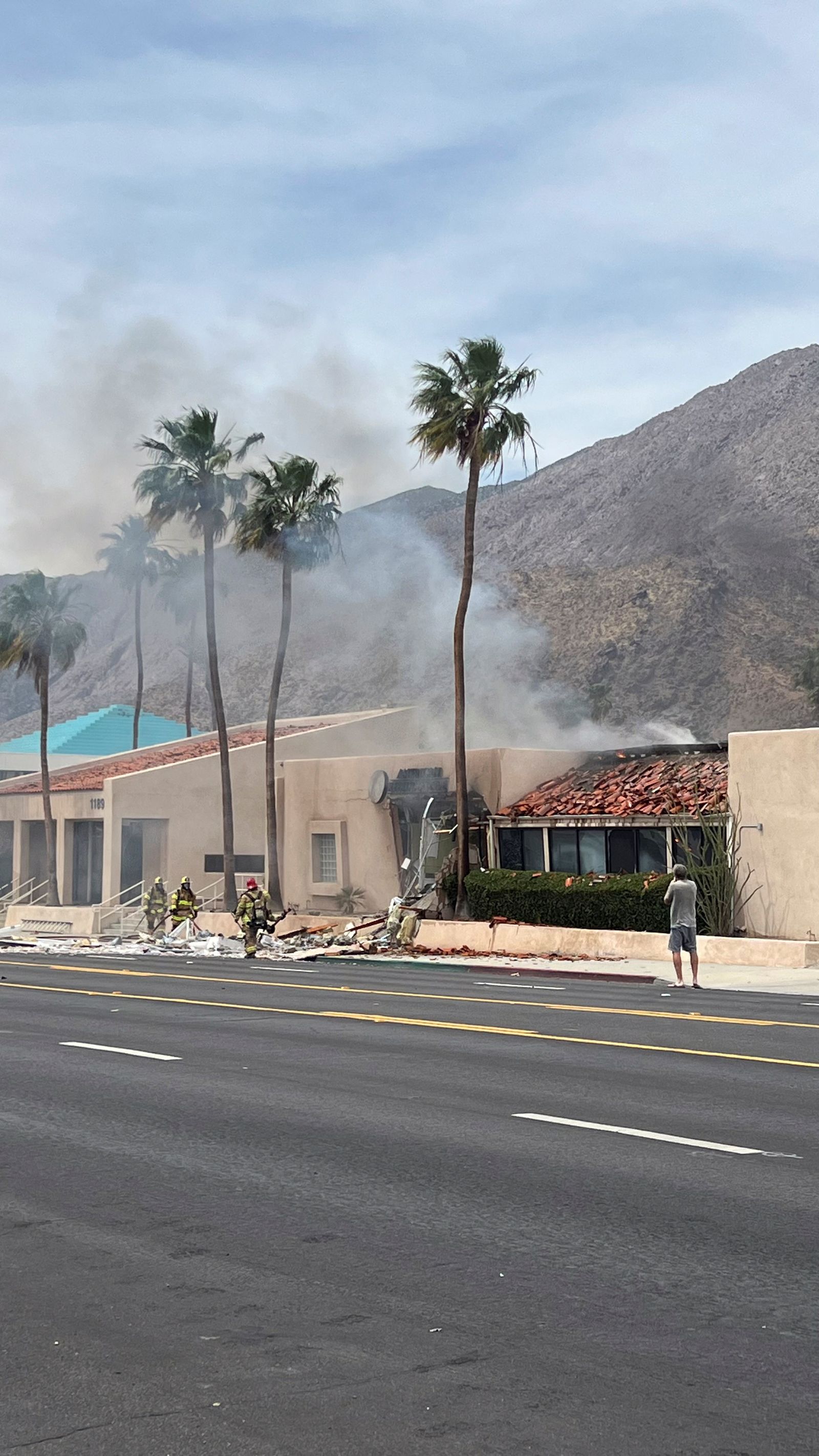 Firefighters work after a bomb exploded near a reproductive health clinic in Palm Springs, California, U.S., May 17, 2025, in this picture obtained from social media. Luis Roman/@luisromanvlog via REUTERS  THIS IMAGE HAS BEEN SUPPLIED BY A THIRD PARTY. MANDATORY CREDIT. NO RESALES. NO ARCHIVES.