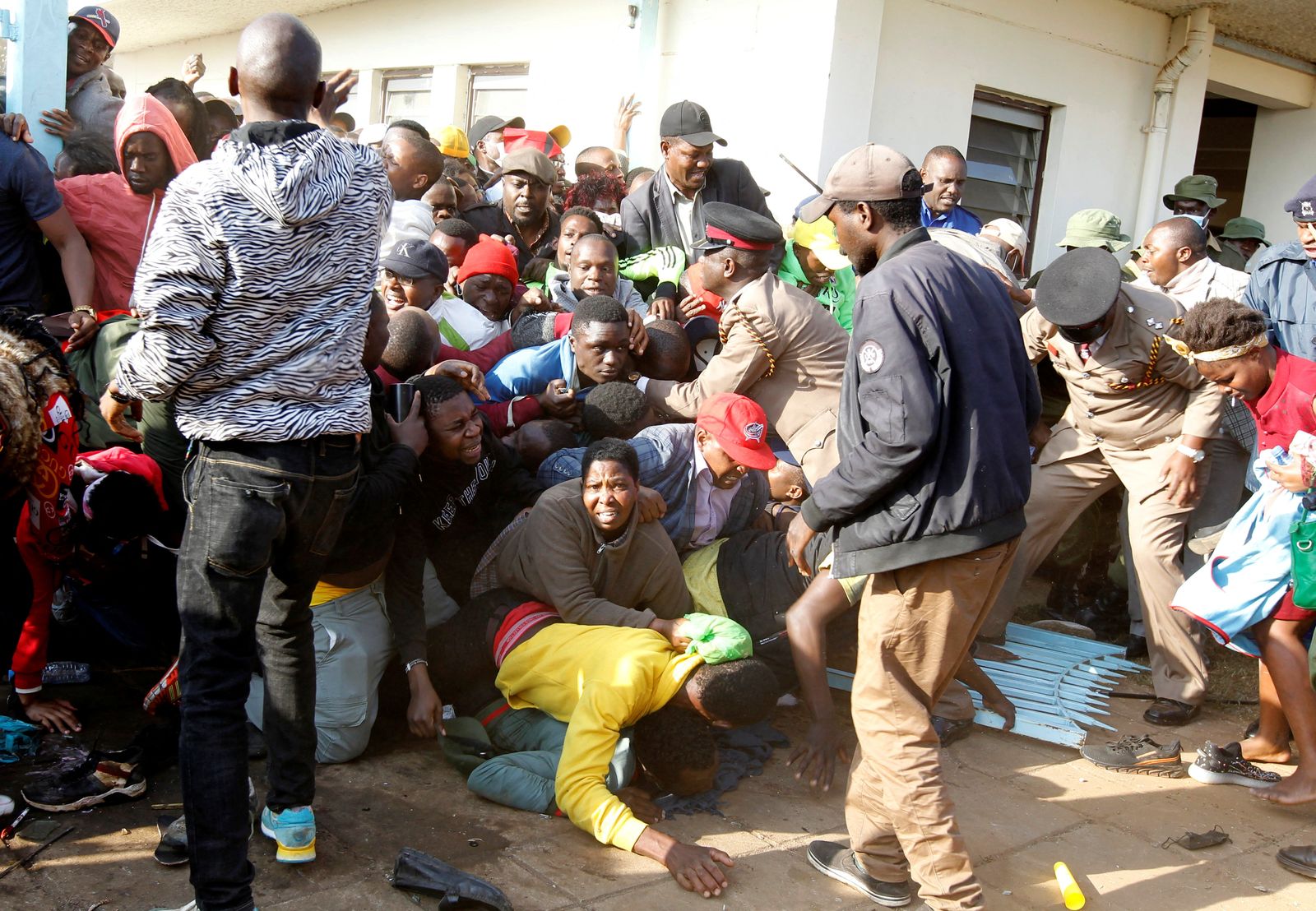 People fall into a stampede as they jostle to attend the inauguration of Kenya's President William Ruto before his swearing-in ceremony at the Moi International Stadium Kasarani in Nairobi - REUTERS