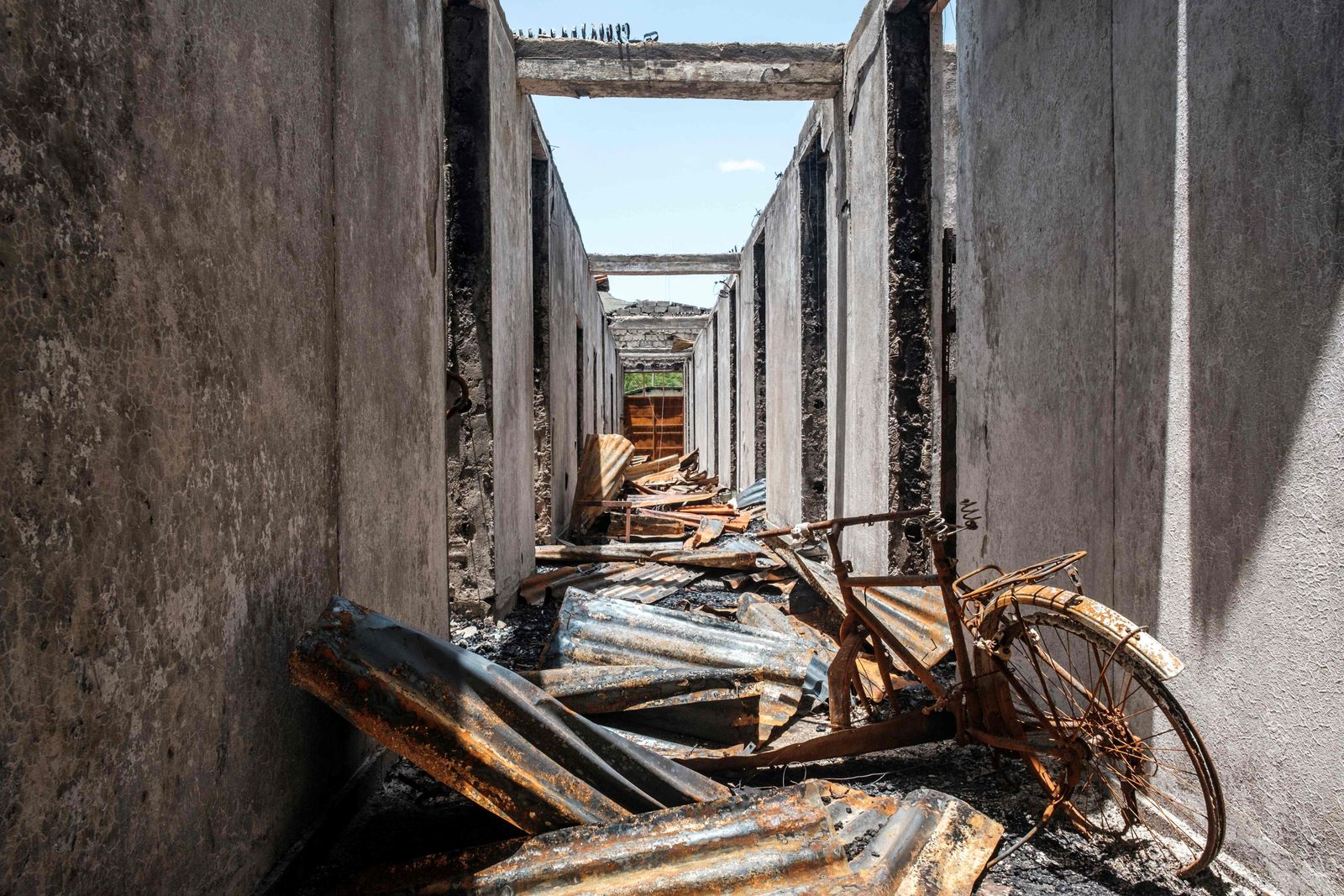 A general view of destroyed property at the Ataye Primary Hospital, in Ataye, Ethiopia, on May 15, 2021. - More than 100 civilians died in a recent flare-up of violence in the town of Ataye that also saw the assailants torch more than 1,500 buildings.
The destruction continues a pattern of unrest that has blighted the tenure of Prime Minister Abiy Ahmed, winner of the 2019 Nobel Peace Prize, and now threatens to disrupt elections in which he'll seek a new term. 
Ethiopia's polls are scheduled for June 21, but officials say insecurity and logistical challenges make voting impossible -- at least for now -- in at least 26 constituencies across the country. (Photo by EDUARDO SOTERAS / AFP) - AFP