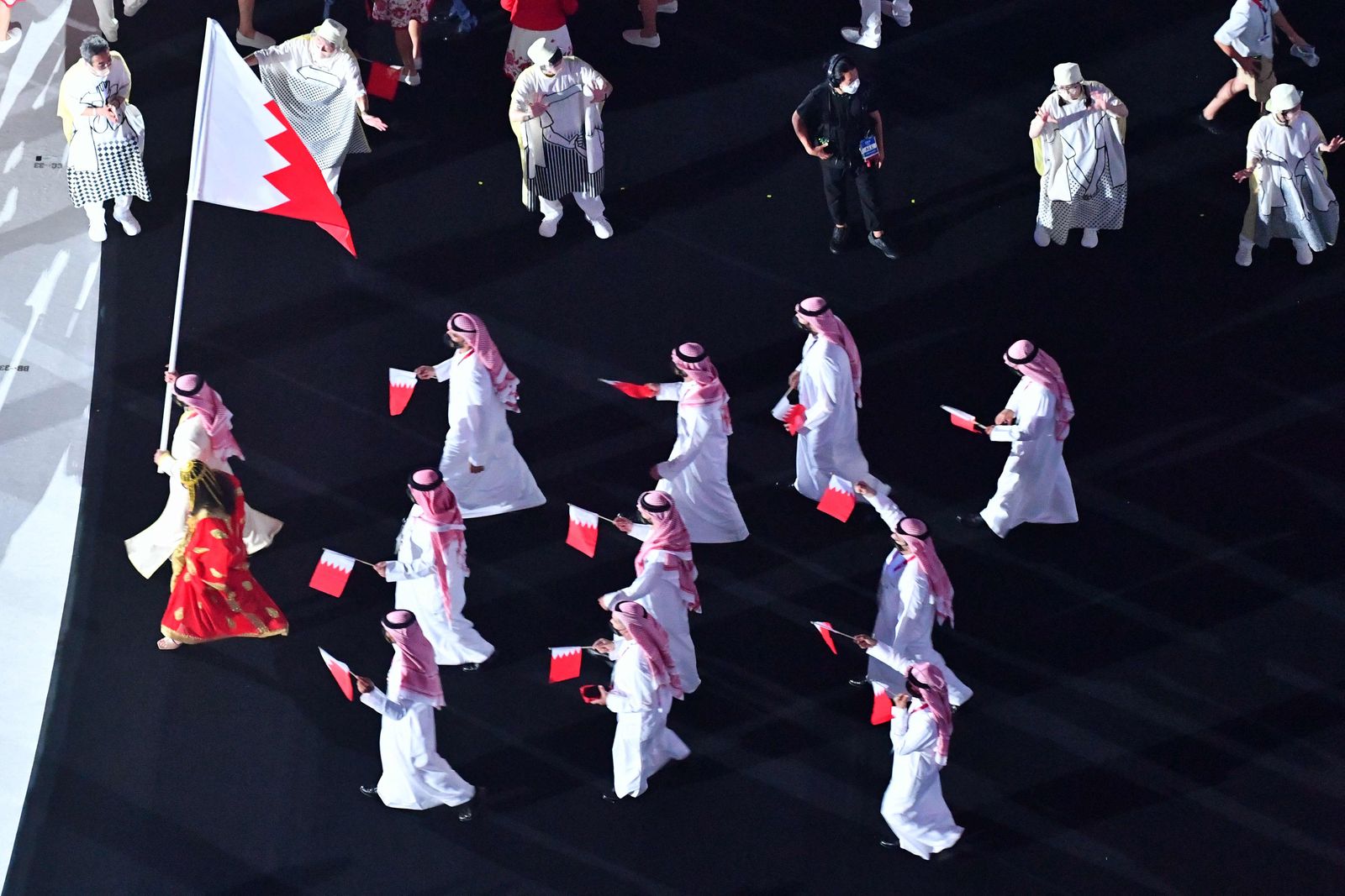 An overview shows Bahrain's delegation entering the Olympic Stadium during the opening ceremony of the Tokyo 2020 Olympic Games, in Tokyo, on July 23, 2021. (Photo by Antonin THUILLIER / AFP) - AFP