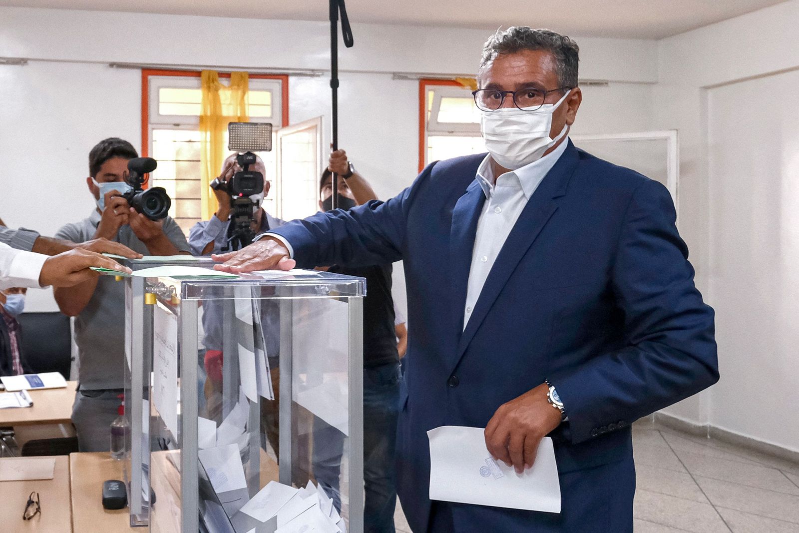 Aziz Akhannouch, president of the National Rally of Independents (RNI), casts his ballot in Agadir on September 8, 2021 as Moroccans vote in parliamentary and local elections. (Photo by STR / AFP) - AFP