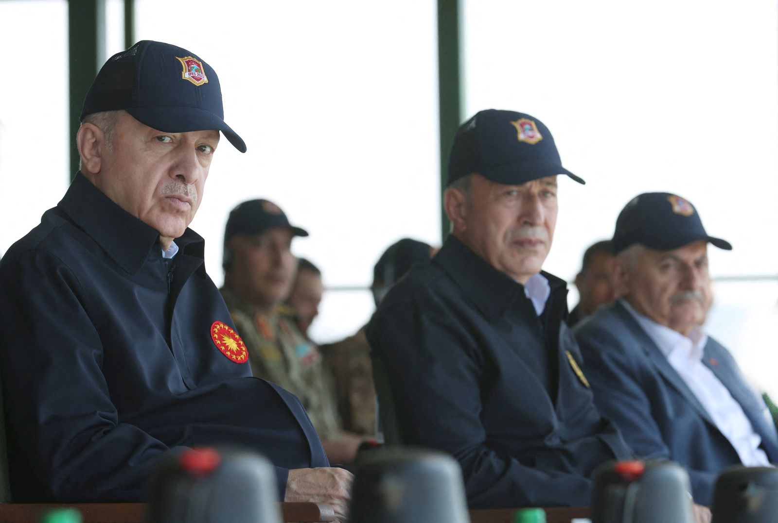 Turkish President Tayyip Erdogan and Defence Minister Hulusi Akar watch a military exercise near Izmir - via REUTERS