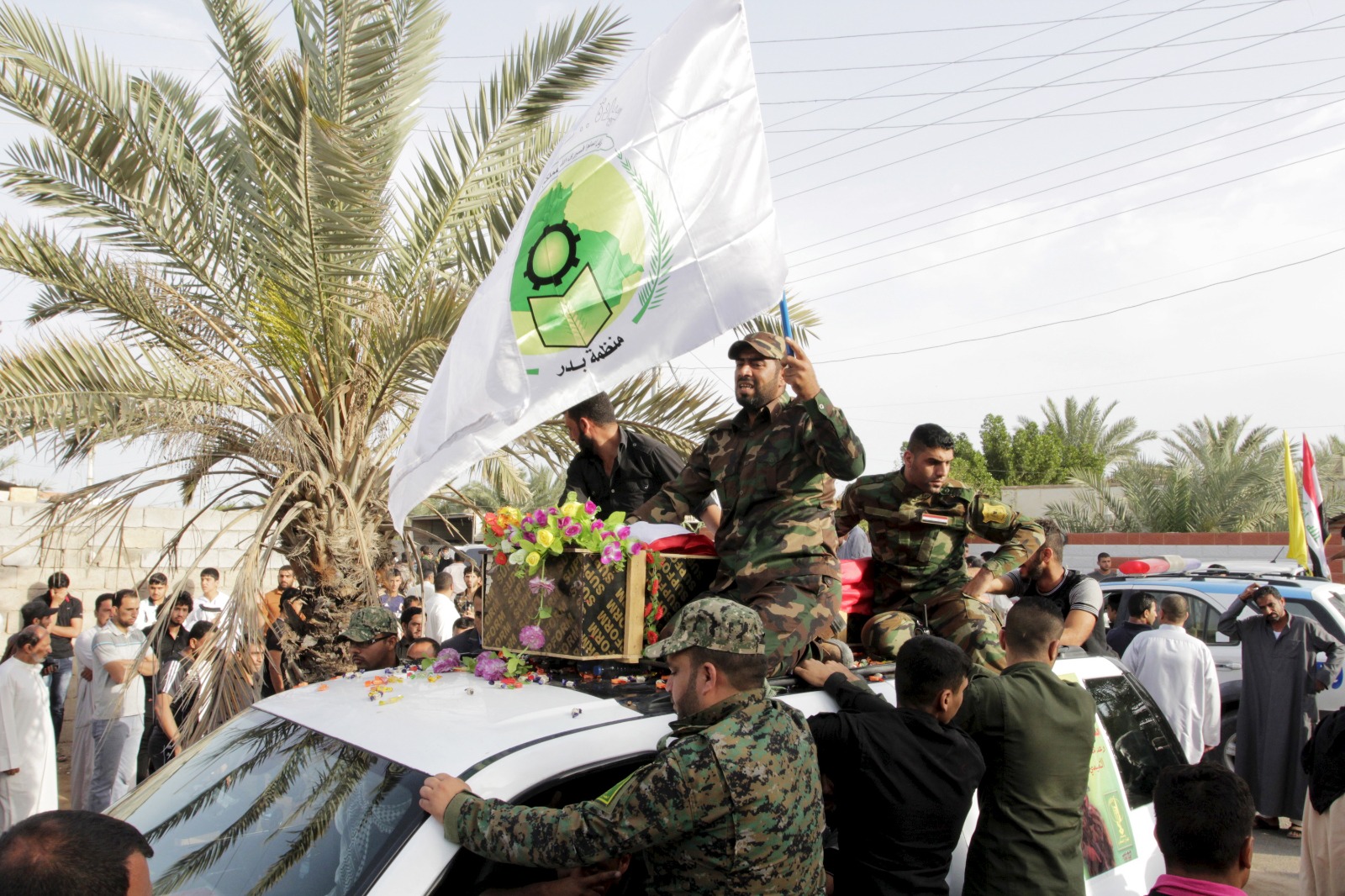 مقاتلون تابعون لمنظمة بدر العراقية خلال عرض بمناسبة يوم القدس السنوي بالعاصمة بغداد- 25 يوليو 2014