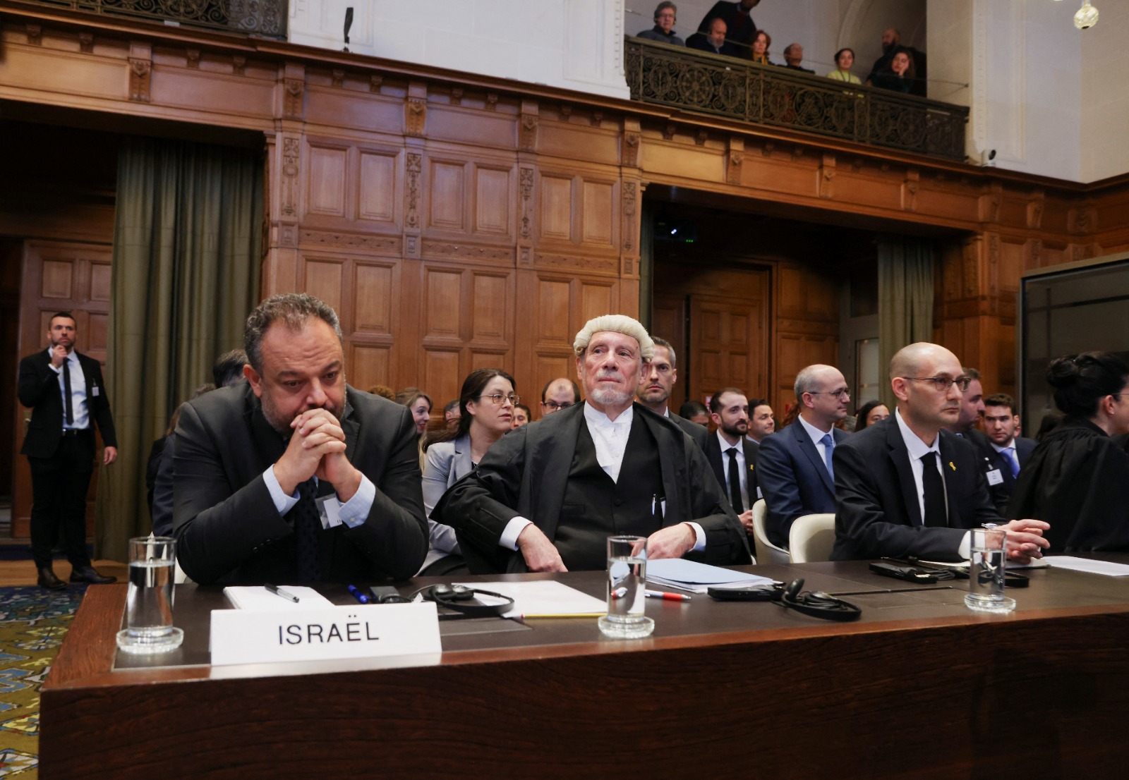 British jurist Malcom Shaw, legal adviser to Israel's Foreign Ministry Tal Becker and Israel's deputy attorney-general for international law Gilad Noam look on as judges at the International Court of Justice (ICJ) hear a request for emergency measures by South Africa, who asked the court to order Israel to stop its military actions in Gaza and to desist from what South Africa says are genocidal acts committed against Palestinians during the war with Hamas in Gaza, in The Hague, Netherlands, January 11, 2024. REUTERS/Thilo Schmuelgen